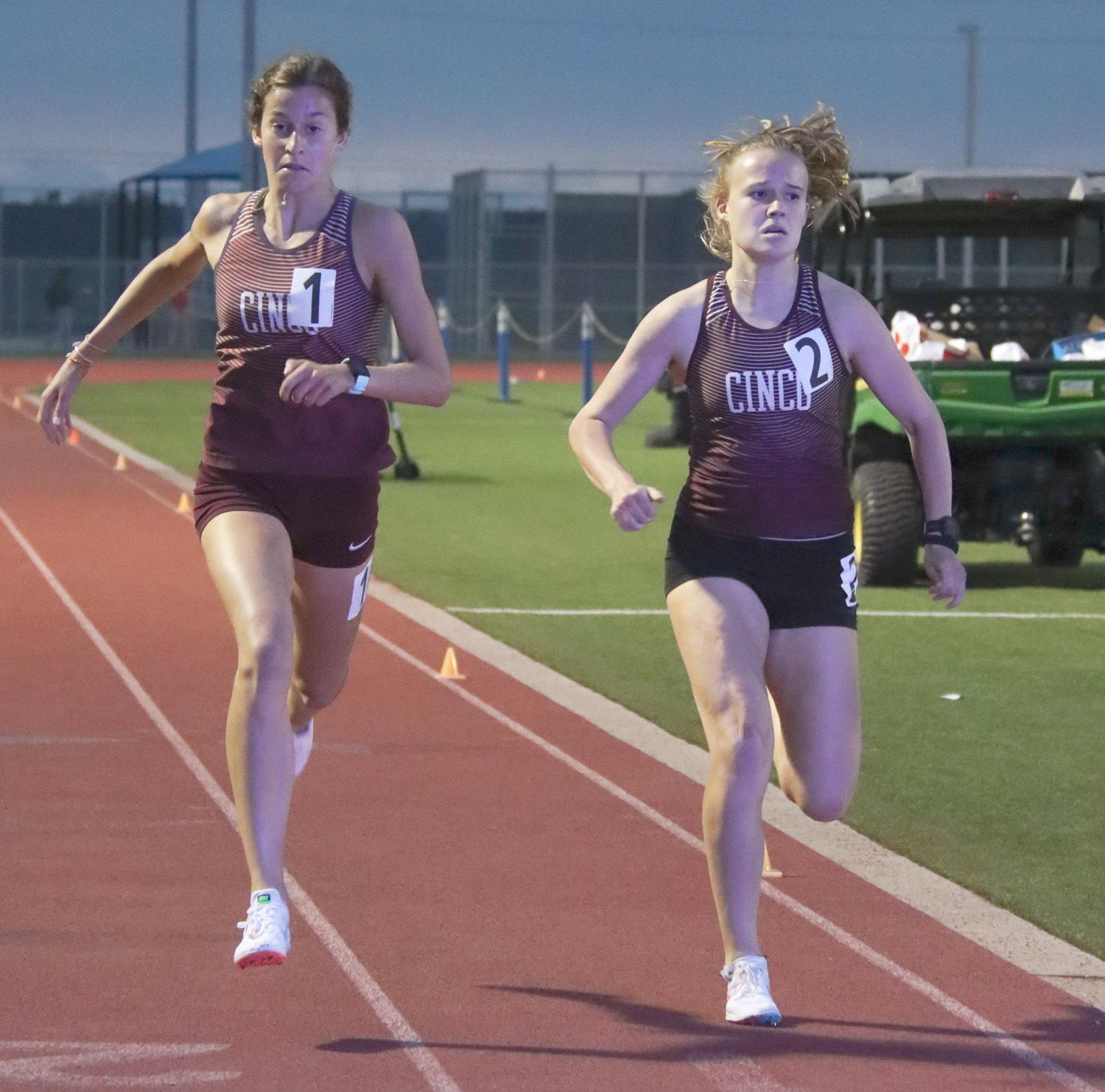 Longtime teammates Sophie Atkinson, left, and Heidi Nielson—shown here competing for Cinco Ranch at the 19-20-6A track and field area meet two weeks ago—are returning to state after starring at the UIL Region III-6A meet last weekend. Atkinson won the 1600-meter and 3200-meter runs and placed second in the 800-meter run. Nielson placed second in the 1600-meter and 3200-meter runs.
